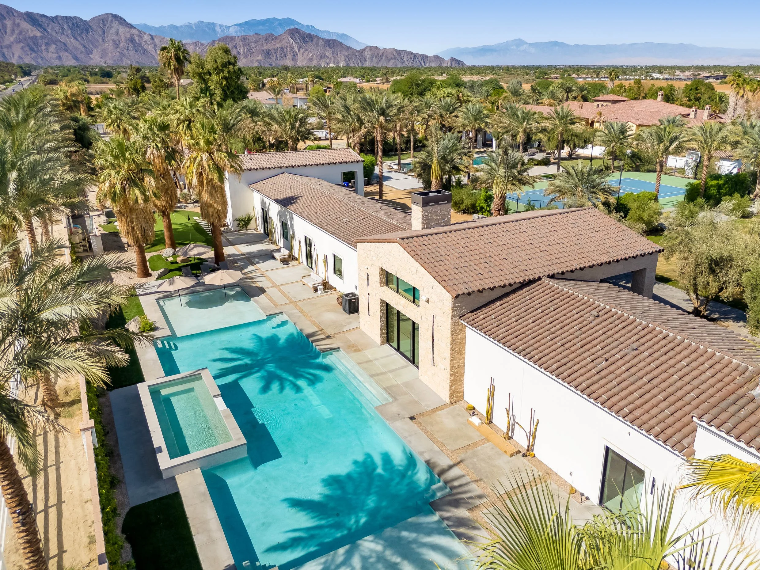 Aerial view of the pool, spa, and patio at Cache Estate