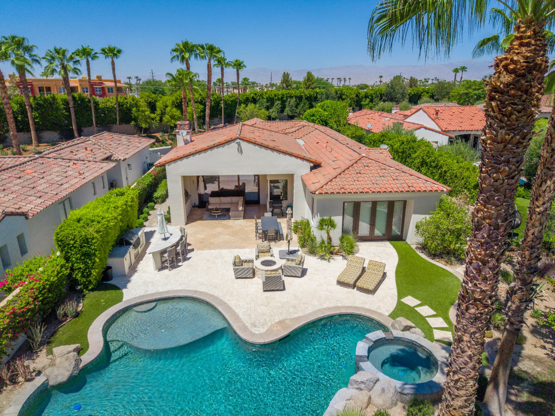 Backyard pool, spa and covered patio from above
