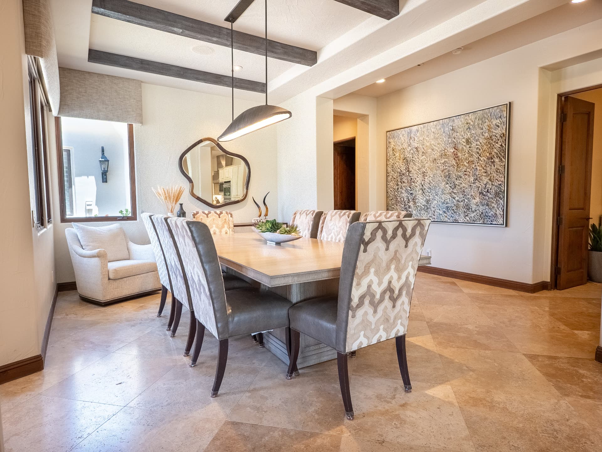 Dining room with sitting nook, artwork and natural light