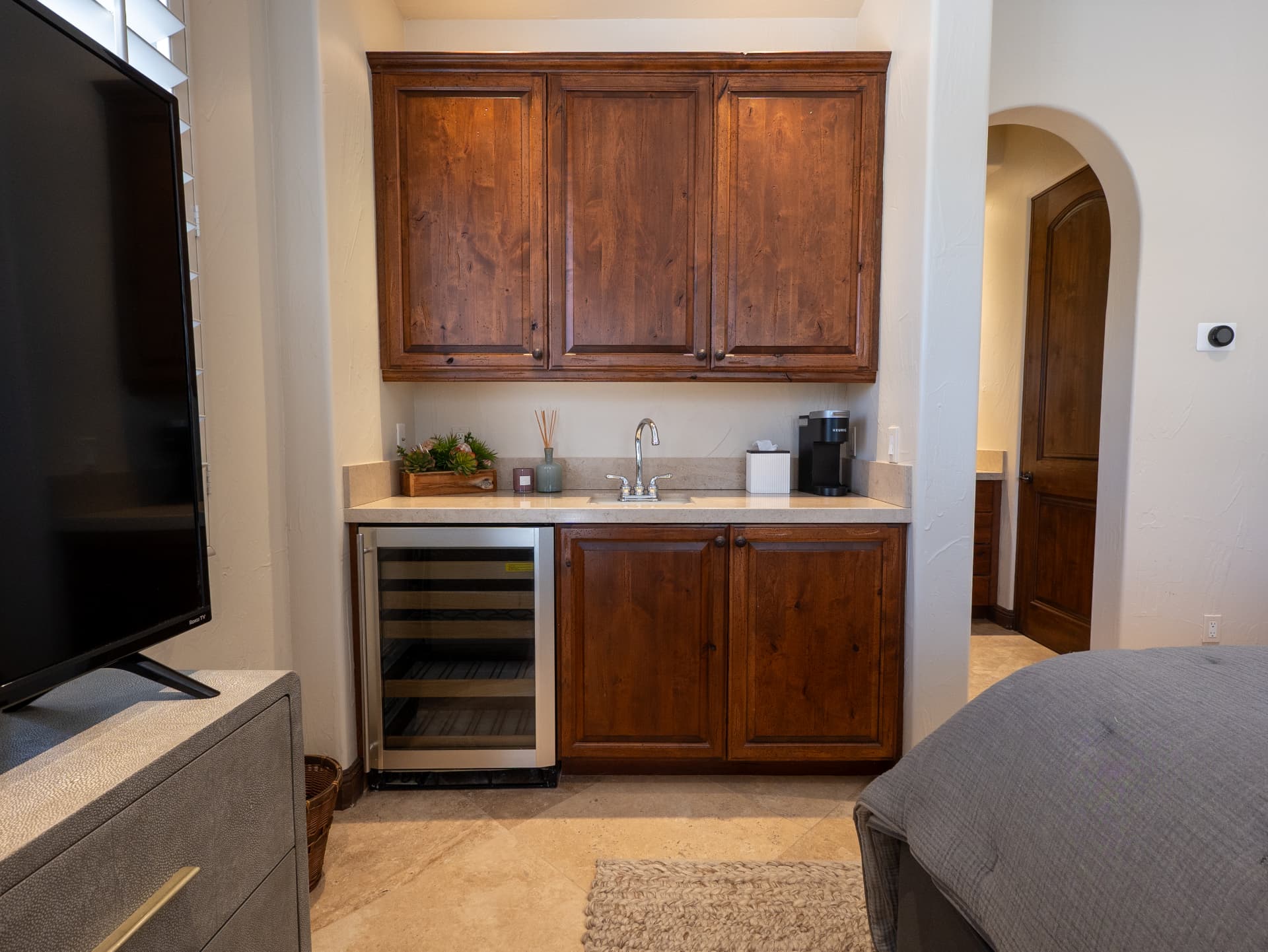 Detail of the in-suite wet bar with custom alder cabinetry
