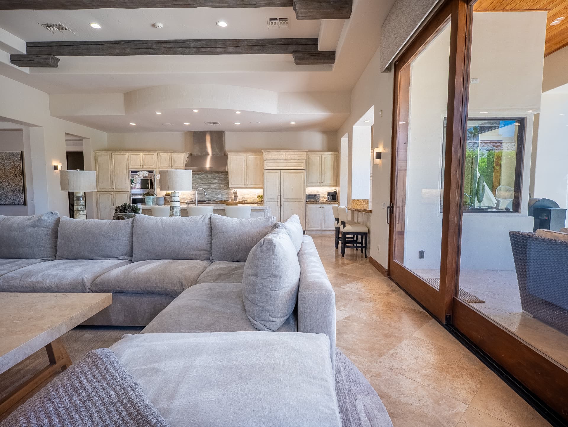 Great room sectional with pocketing glass doors to the patio