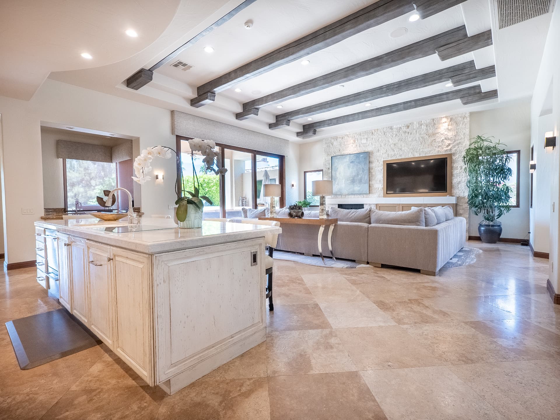 Open concept living room with expansive glass walls
