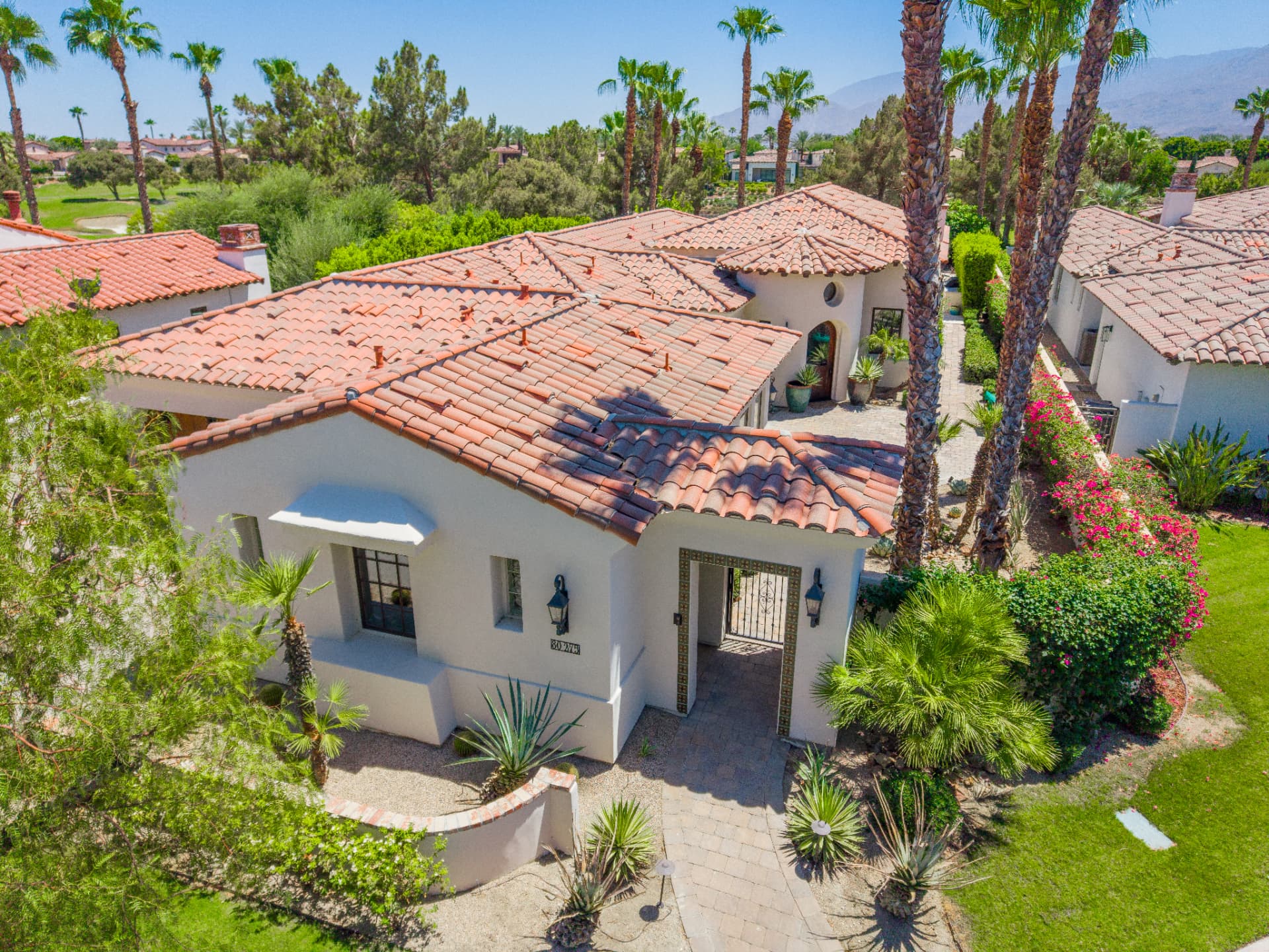 Elevated view of the entry courtyard and tile roofline